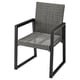 A gray VÄRMANSÖ patio chair with a wicker seat and back, black metal frame, armrests, and sleek design.
