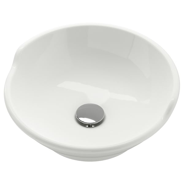 A VÄSTERSJÖN white ceramic wash-basin with a round bowl, soft edges, and a raised back. It has a chrome-plated lid for the water trap.