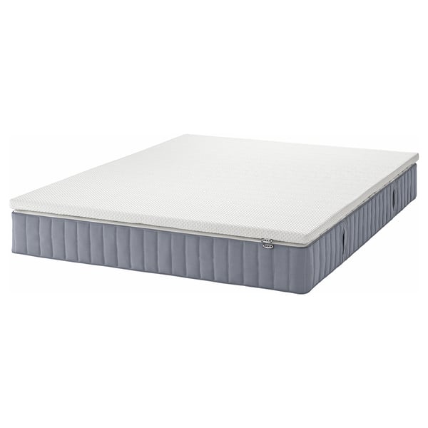 Gray ikea VALEVÅG pocket spring mattress with removable cover.