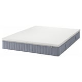 Gray ikea VALEVÅG pocket spring mattress with removable cover.