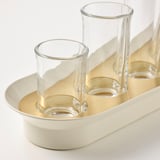 Clear glass vases held in metallic tray, elegant and functional display.