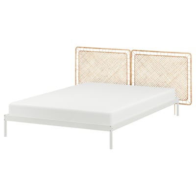 VEVELSTAD bed: modern, white metal frame, rattan headboard, clean lines.
