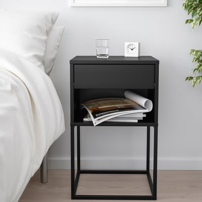 A black VIKHAMMER bedside table with a drawer and an open shelf, featuring a modern metal frame and a sleek design.