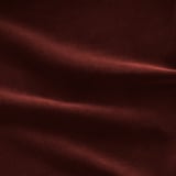 Rich burgundy sofa, plush and inviting, showcasing modern design and quality craftsmanship.