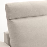 Close-up of a modern, gray sofas backrest and armrest, showcasing high-quality upholstery and design.