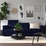 VIMLE navy sofa, modern minimalist design. Centered, its larger than side items.