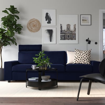 Blue VIMLE sofa, black & white decor, round coffee table, wall gallery - cozy & stylish.