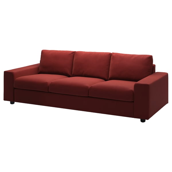 Red VIMLE sofa, modern minimalist design, velvet fabric, three cushions, wooden legs.