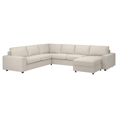 The VIMLE sectional sofa is a light beige, modular design with a chaise longue and storage, offering comfort and versatility.