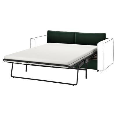 A green VIMLE sofa bed in a modern design with metal legs.