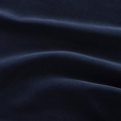 Dark blue velvet fabric close-up, smooth and shiny texture, luxurious feel.