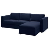 A navy blue l-shaped sofa with a modern, minimalist design. It has a smooth fabric cover and clean lines.