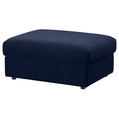 A navy blue VIMLE footstool with a rectangular, upholstered design in durable velvet, providing a comfortable and stylish addition to living spaces.
