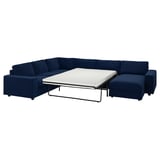 Blue sectional sofa with pull-out bed, modern design, dark fabric.