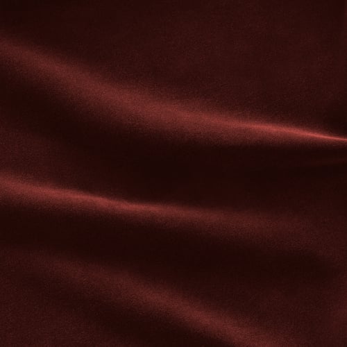 Rich velvet texture, deep red hue, slight shine. Soft, sumptuous sofa cover.