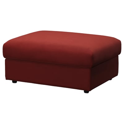 Red VIMLE footstool with hidden storage, rectangular shape, soft velvet cover.