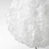 Elegant white lampshade with soft, flowing fabric, creating a cozy ambiance.