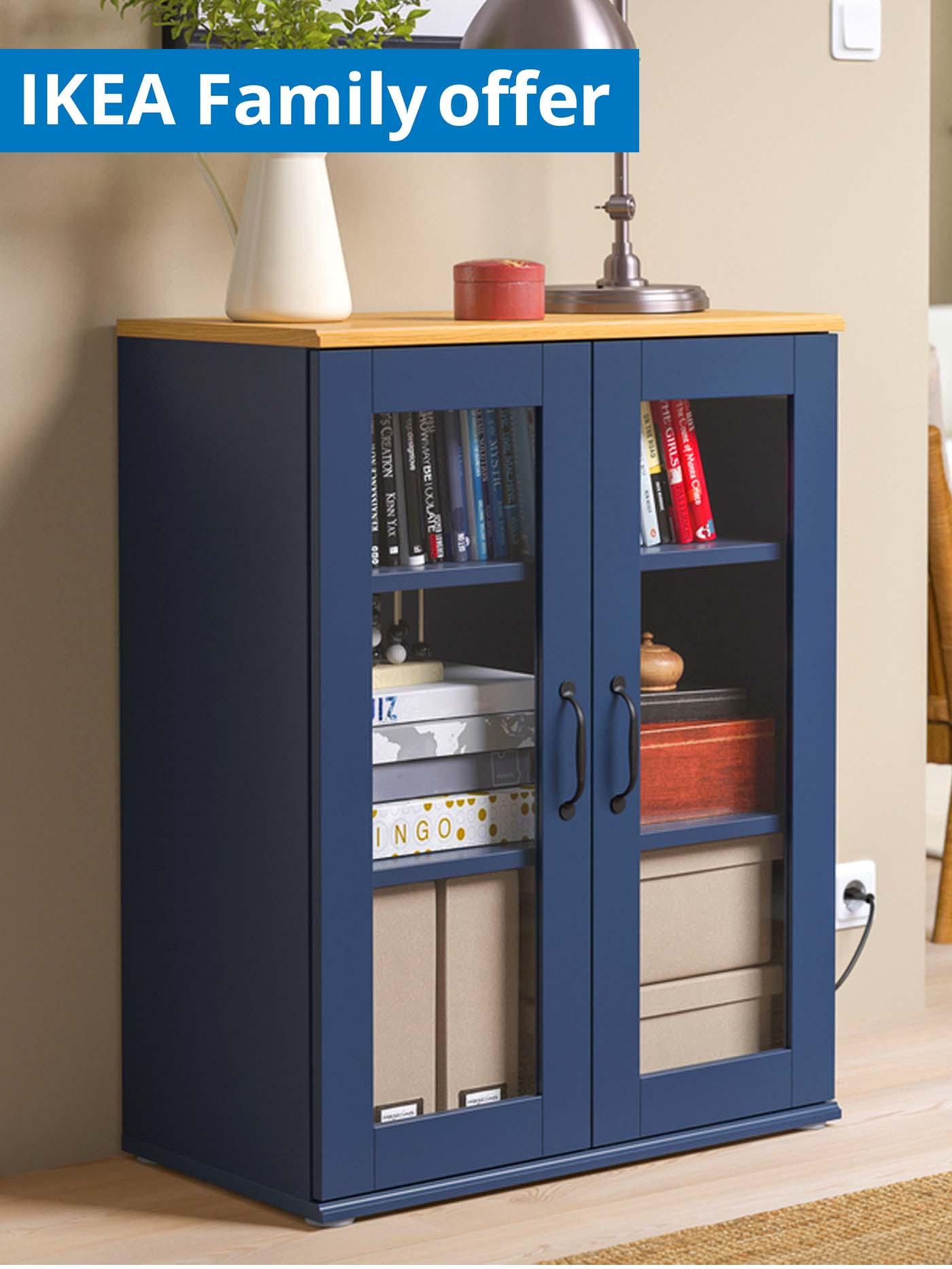 1 - 25 August IKEA Family offer. Blue SKRUVBY cabinet with glass doors, in the living room.