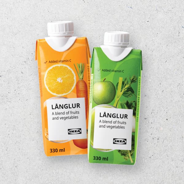 2 bottles of juice on grey concrete background