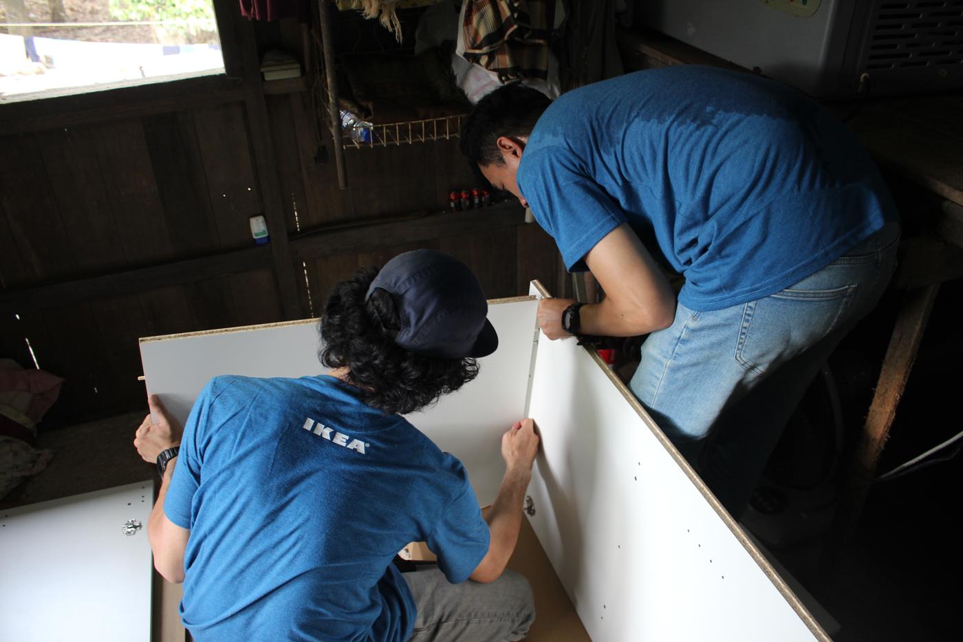 2 IKEA co-workers is combining part of the wardrobes together