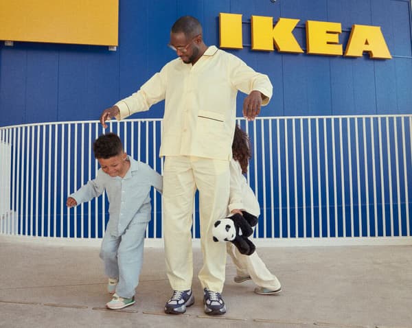 2 kids playing with an adult