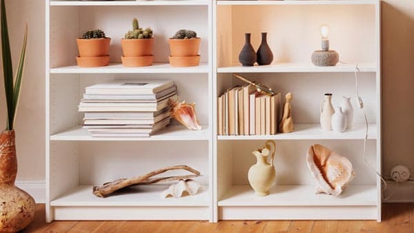 2 short BILLY bookcases with various items on them