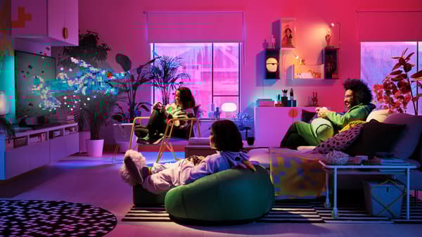 3 family members gaming using a BRÄNNBOLL gaming easy chair and a BRÄNNBOLL inflatable gaming chair.