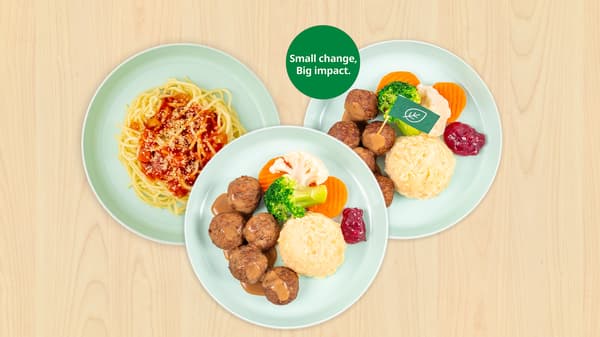 3 plates of kids meals. Kids meatball, kids plant balls and kid's pasta are featured with plats overlapping one another. A green cirlce with the text, "Small change, Big impact" is seen on top of the palt of Kids plant balls.