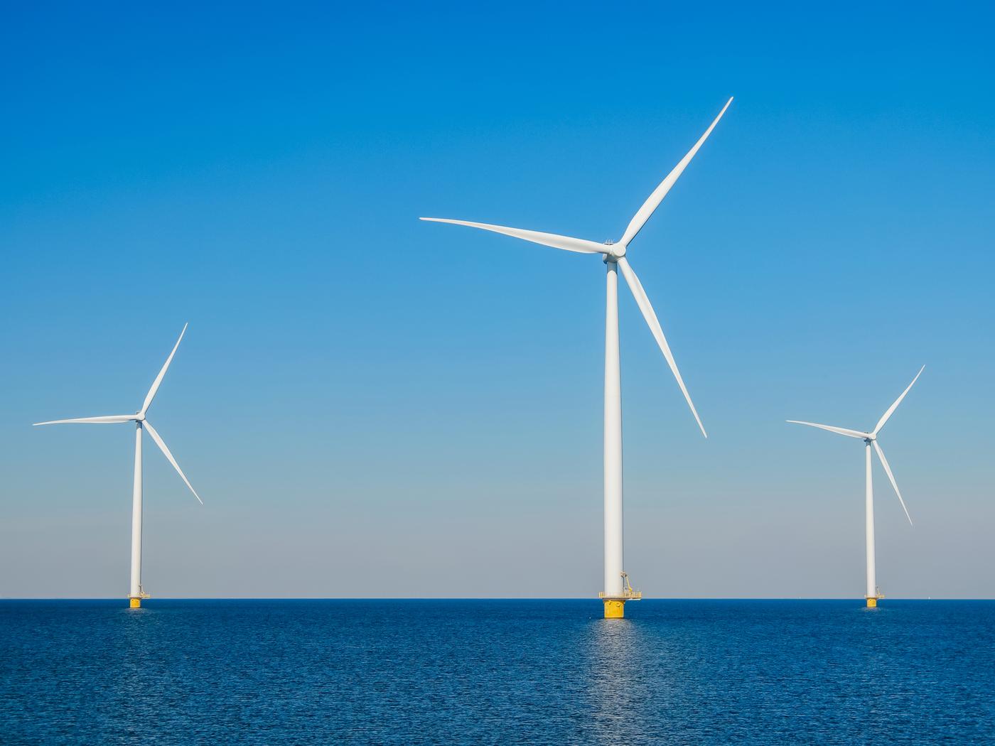 3 windmills in the midle of the sea