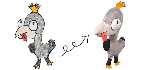 A drawing of a gray bird with an arrow pointing to a soft toy created from the drawing against a white background.