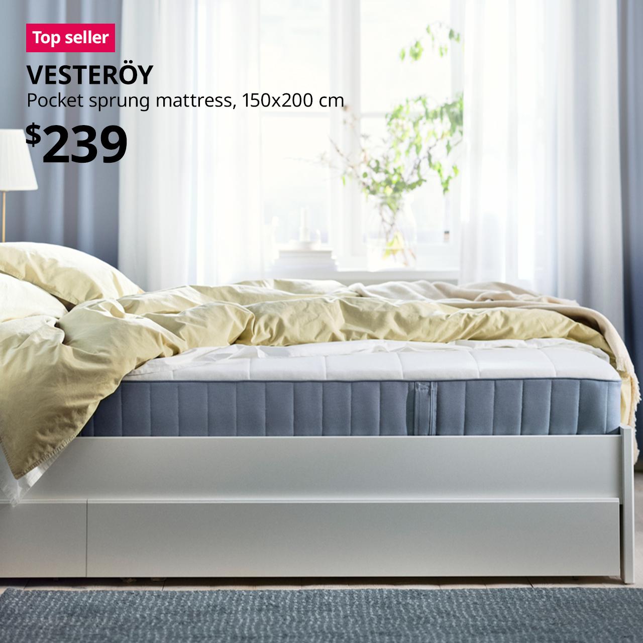 A 150x200 cm firm/light blue VESTERÖY pocket sprung mattress in bed room setting. A red "Top seller" label is on the top left of image, with black text below that reads: VESTERÖY, Pocket sprung mattress, 150x200 cm. Priced at $239.