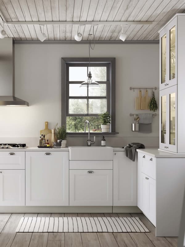 A AXSTAD white kitchen with a window above the sink.