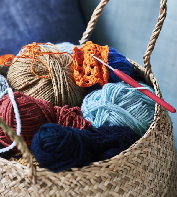 A basket filled with colourful yarn.