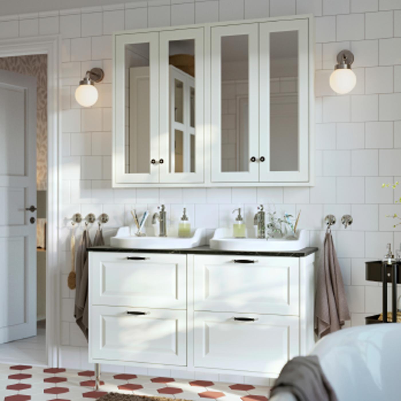 A bathroom featuring white TÄNNFORSEN wash-stands with doors and drawers, mirror cabinets with doors and a high cabinet.