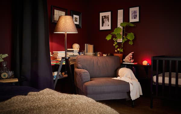 A bedroom late at night with a few soft lights on.