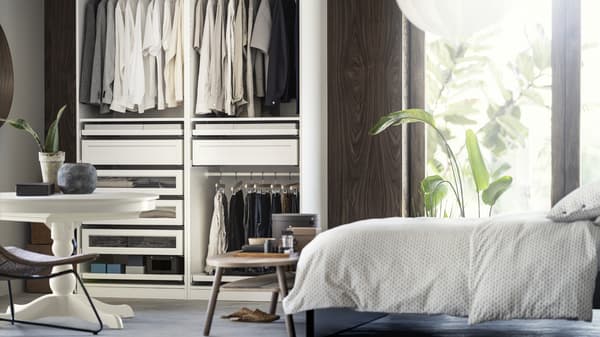 A bedroom with a raised floor and a wardrobe closet.