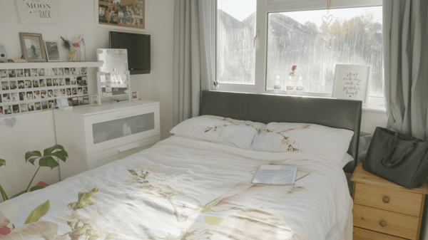 A big bed, and the walls were painted plain white