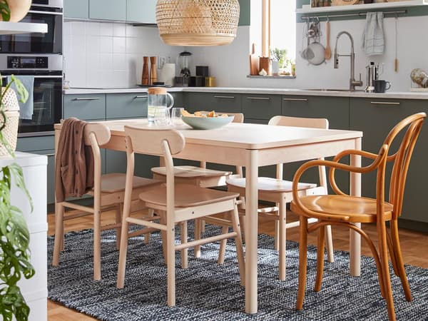A birch wood dinner table and four chairs from the RÖNNINGE series, plus an IKEA chair from the 60’s.
