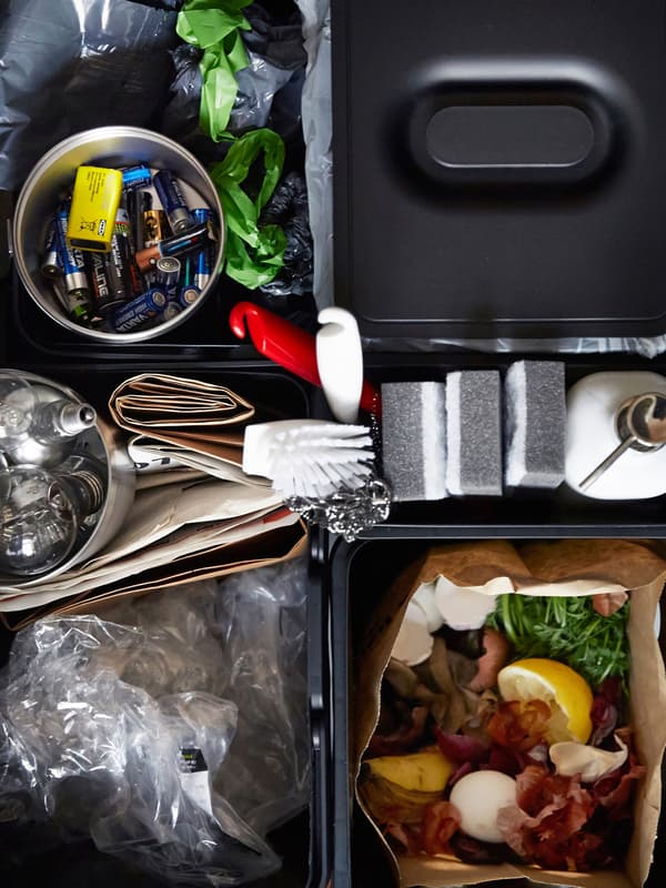 A bird's-eye view of a rubbish sorting drawer, designed to simplify recycling.