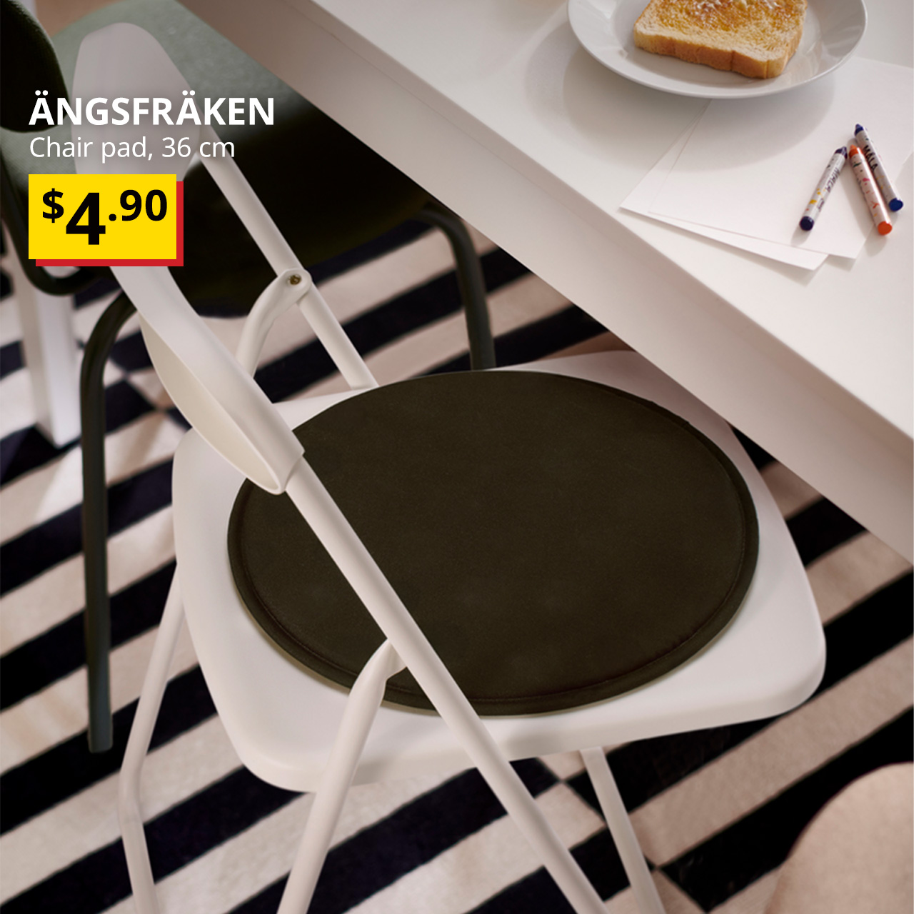 A black ÄNGSFRÄKEN Chair pad. Black text on top left of the image reads: ÄNGSFRÄKEN, Chair pad, 36 cm, $4.90.