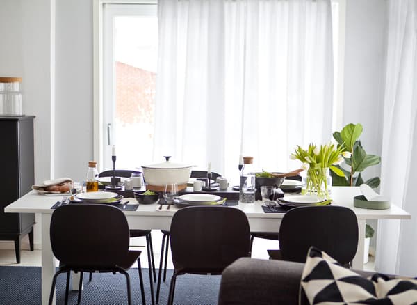 A black-and-white dining table and chairs.