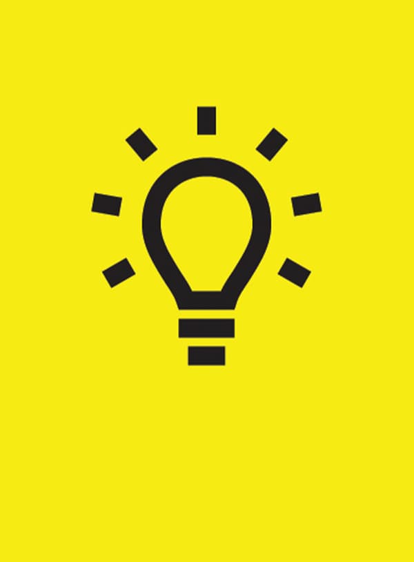 A black and white graphic symbol of a bright light bulb 