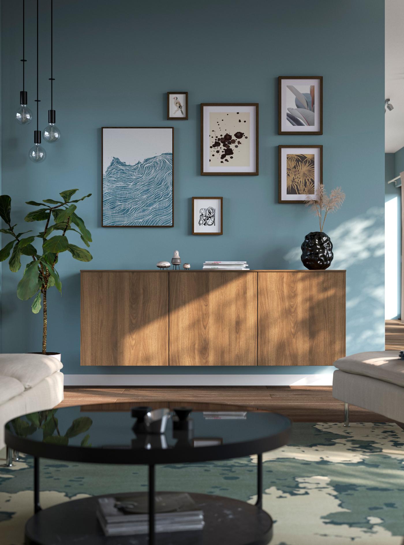 A black-brown Lappviken/brown walnut effect BESTÅ wall-mounted cabinet combination in the living room