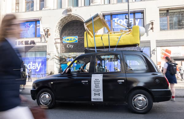 A black can with IKEA sofa on top of it