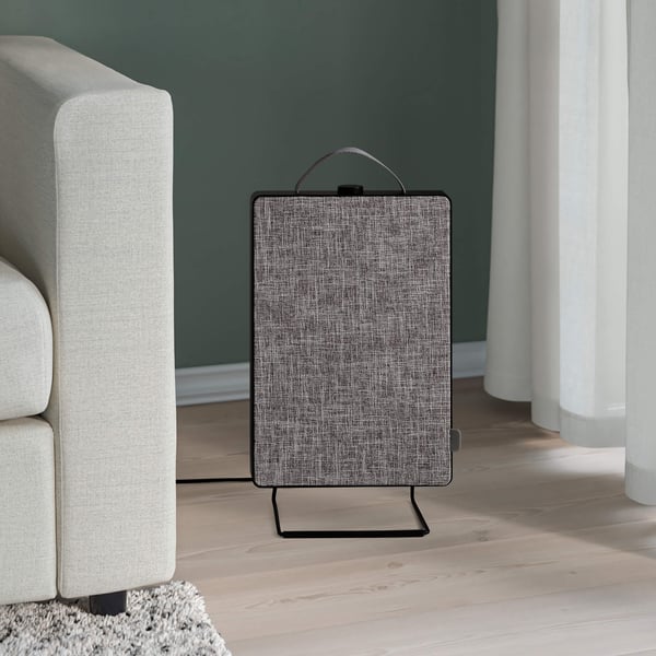 A black FÖRNUFTIG air purifier in a living room.