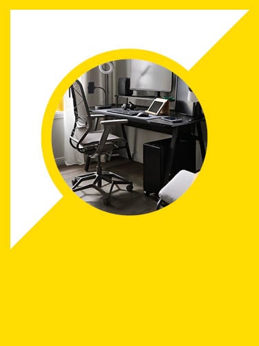 a black gaming desk with a gaming chair