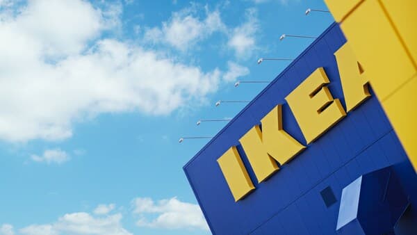 A blue IKEA store building with a giant IKEA logo in yellow.