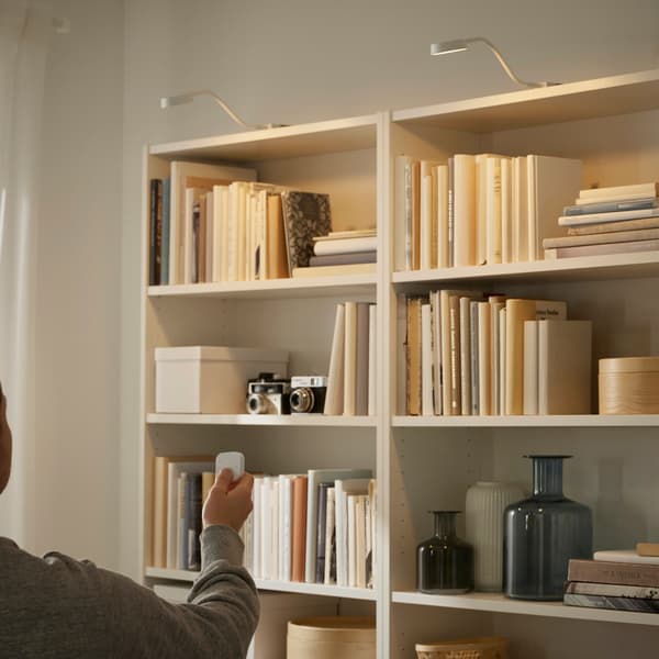 A bookcase with lighting directed at the books