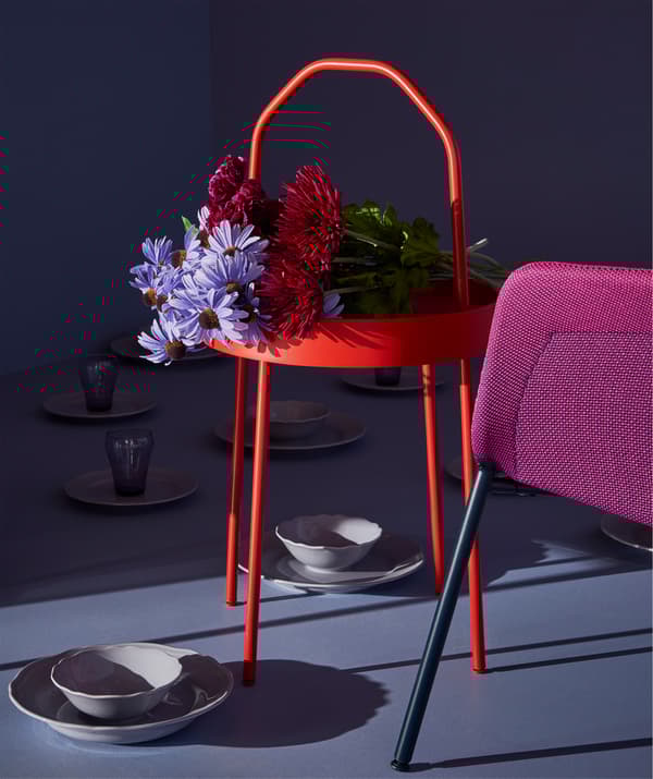 A bouquet of flowers top off the artful framing of a BURVIK side table.