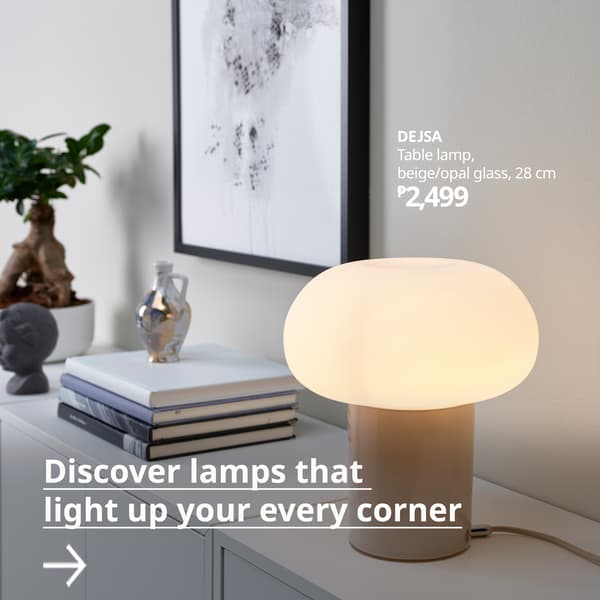 A brass/white ÅRSTID table lamp